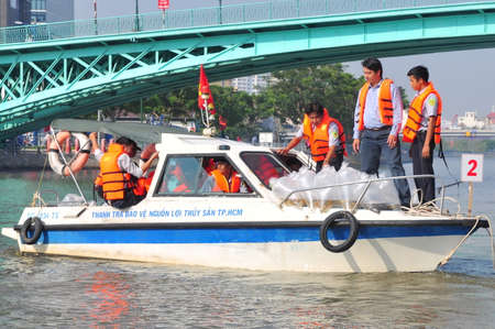 HO CHI MINH CITY, VIETNAM - APRIL 24, 2015: Fishes are kept in plastic bags preparing to be released in the Saigon river in the National Fisheries day in Vietnamのeditorial素材