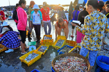 NHA TRANG, VIETNAM - OCTOBER 5, 2011: Women are selling fresh fishes at a local seafood market in Vinh Luong portのeditorial素材