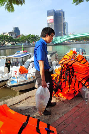 HO CHI MINH CITY, VIETNAM - APRIL 24, 2015: Fishes are kept in plastic bags preparing to be released in the Saigon river in the National Fisheries day in Vietnamのeditorial素材