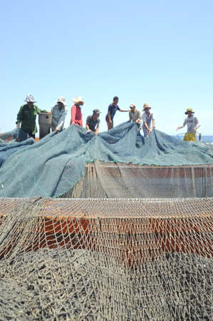 NHA TRANG, VIETNAM - MAY 5, 2012: Fishermen are trawling for tuna fish in the sea of Nha Trang bay in Vietnamのeditorial素材
