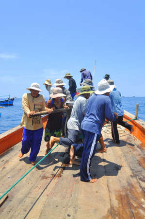 NHA TRANG, VIETNAM - MAY 5, 2012: Fishermen are trawling for tuna fish in the sea of Nha Trang bay in Vietnamのeditorial素材