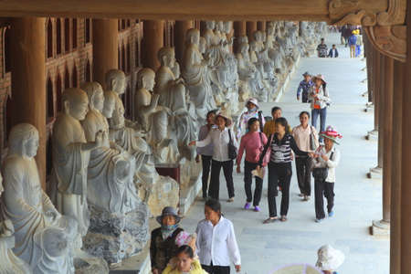 NINH BINH, VIETNAM - MARCH 29, 2010: People are reaching to the Bai Dinh Pagoda, one of the largest one in the southern east asia in Vietnamのeditorial素材