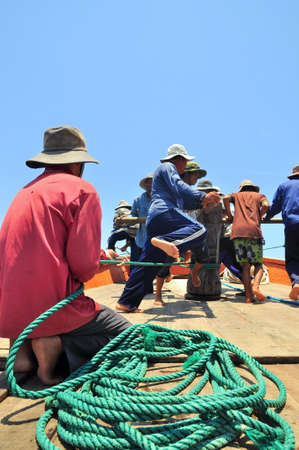 NHA TRANG, VIETNAM - MAY 5, 2012: Fishermen are trawling for tuna fish in the sea of Nha Trang bay in Vietnamのeditorial素材