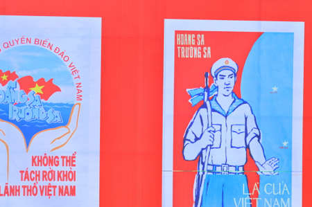 Nha Trang, Vietnam - July 11, 2015: A propaganda poster about protecting the Spratly islands in the square in Vietnamのeditorial素材