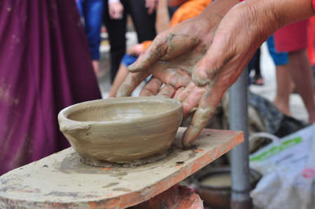 Nha Trang, Vietnam - July 11, 2015: An old woman is performing the ceramic molding techniques at the Po Nagar temple in Nha Trangのeditorial素材