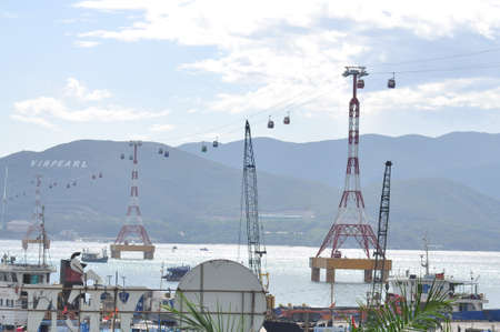 Nha Trang, Vietnam - July 13, 2015: Telpher are transfering travellers from the dock to islandのeditorial素材