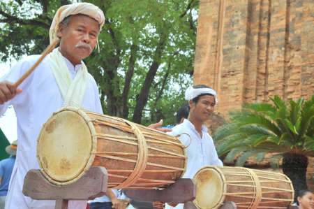 Nha Trang, Vietnam - July 11, 2015: Two old men are performing the traditional drums technique of champa at the Po Nagar temple in Nha Trangのeditorial素材