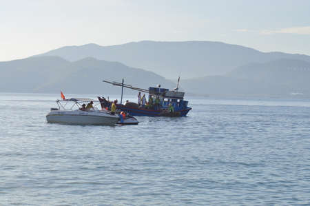 Nha Trang, Vietnam - Jul 14, 2015: Local fishing boat is mooring in the sea of Nha Trang bayのeditorial素材