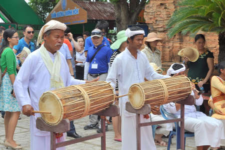 Nha Trang, Vietnam - July 11, 2015: Two old men are performing the traditional drums technique of champa at the Po Nagar temple in Nha Trangのeditorial素材