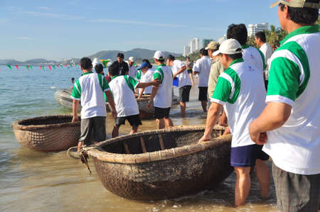 Nha Trang, Vietnam - July 14, 2015: Fishermen are ready for a basket boat racing in the sea of Nha Trang bayのeditorial素材