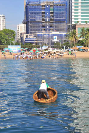 Nha Trang, Vietnam - July 14, 2015: Fishermen are racing by basket boats in the sea of Nha Trang bay