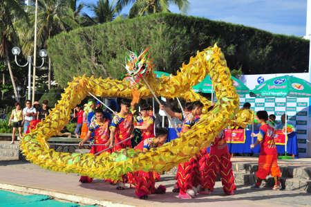 Nha Trang, Vietnam - July 14, 2015: Young boys are performing the lion dance on the beach of Nha Trang cityのeditorial素材