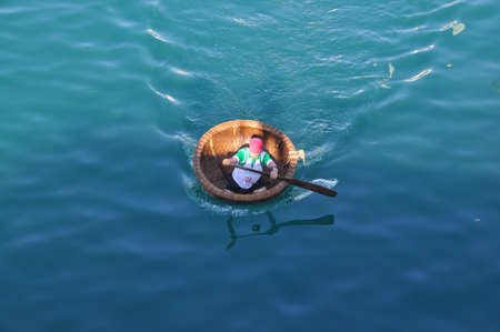 Nha Trang, Vietnam - July 14, 2015: Fishermen are racing by basket boats in the sea of Nha Trang bayのeditorial素材