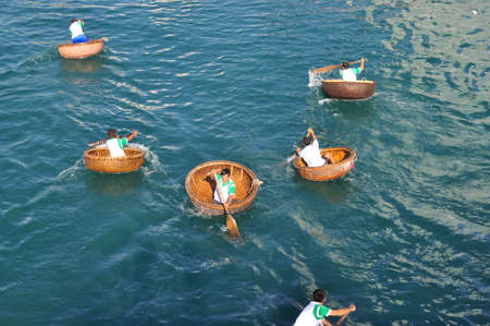 Nha Trang, Vietnam - July 14, 2015: Fishermen are racing by basket boats in the sea of Nha Trang bayのeditorial素材