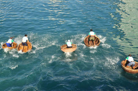 Nha Trang, Vietnam - July 14, 2015: Fishermen are racing by basket boats in the sea of Nha Trang bayのeditorial素材