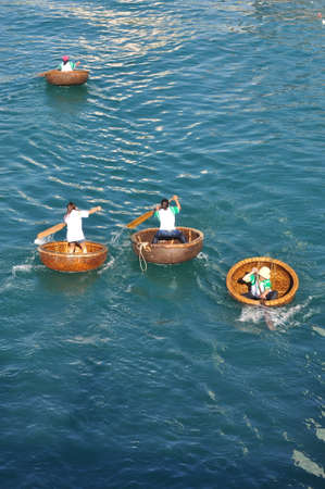 Nha Trang, Vietnam - July 14, 2015: Fishermen are racing by basket boats in the sea of Nha Trang bayのeditorial素材