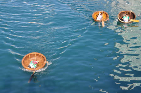 Nha Trang, Vietnam - July 14, 2015: Fishermen are racing by basket boats in the sea of Nha Trang bayのeditorial素材