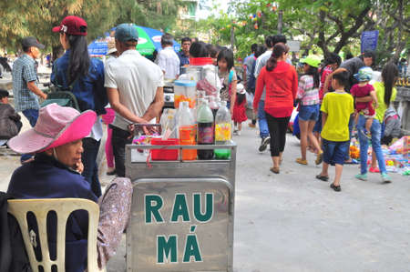 Cam Ranh, Vietnam - February 9, 2016: Street food vendors are serving people in the lunar new year in Vietnamのeditorial素材