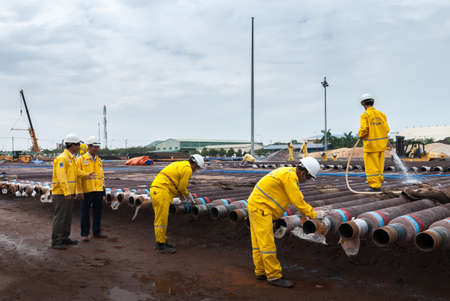 Vung Tau, Vietnam - May 29, 2016: Workers are checking the oil pipes before taking into operation in the seaのeditorial素材