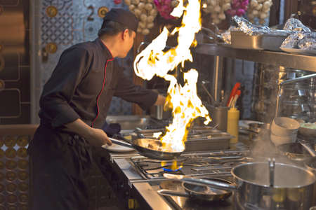 Hanoi, Vietnam - October 29, 2015: A chef in a hotel is showing his brilliant technique in cooking to visitors in Ha Noi cityのeditorial素材