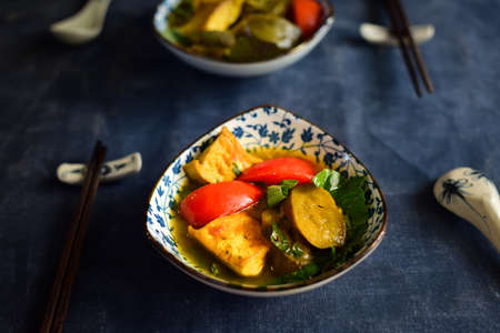 Vietnamese fried eggplant with tomato on the tableの写真素材