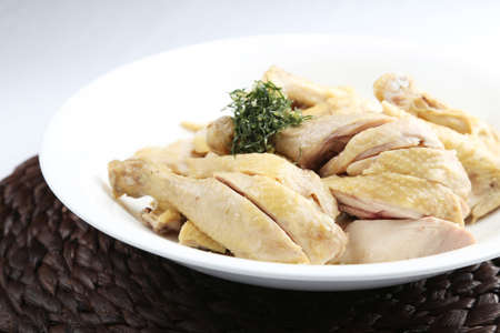 Salted raw chopped boile dchicken on white dishの写真素材