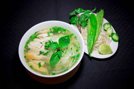 Pho ga or Vietnamese rice noodle soup with sliced chickenの写真素材