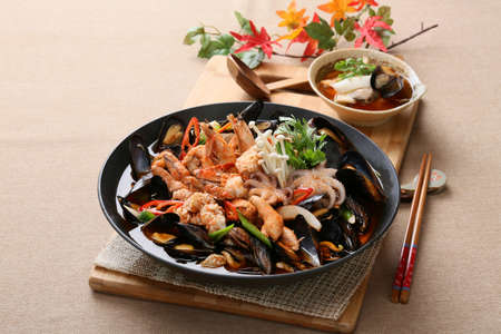 Cool and spicy seafood soup taste with octopus, clams, mussels and shrimpsの写真素材