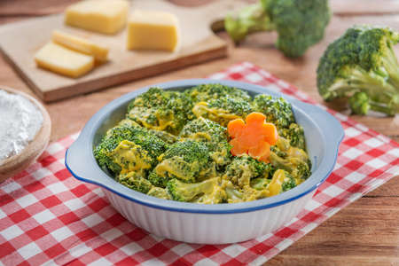Bowl of salad with cauliflower and cheese on the table in restaurantの写真素材