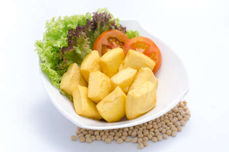 Fried tofu with salad and tomato on white bowlの写真素材