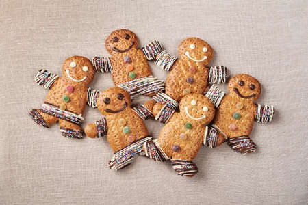 Gingerbread man biscuit cookies for Christmas on grey backgroundの写真素材