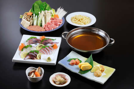 Japanese hot pot of sushi, beef, pork, mushroom, tofu, noodle and cabbageの写真素材