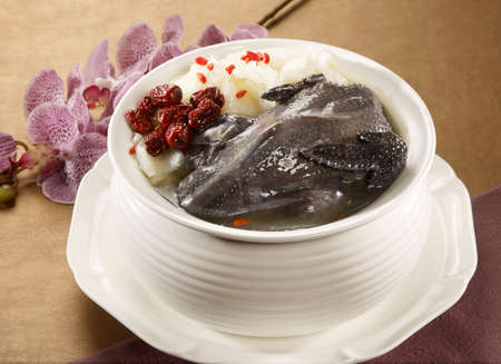 Flower cultivation gouache Phoenix of black chicken soup in white bowlの写真素材