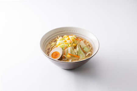 Japanese Koishiwara grilled ramen bowl with egg, cabbage, noodle and corn on white backgroundの写真素材
