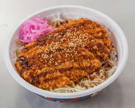 Traditional Japanese fried meat of Sosukatsu with vegetables in bowlの写真素材