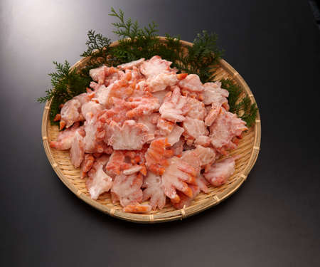 Boyle red snow crab shoulder meat half-cut on bamboo tray in grey backgroundの写真素材