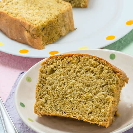 Sliced Egg cake on white platter in the kitchenの写真素材