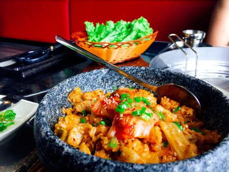 Hot bowl of Kimchi rice in Korean styleの写真素材