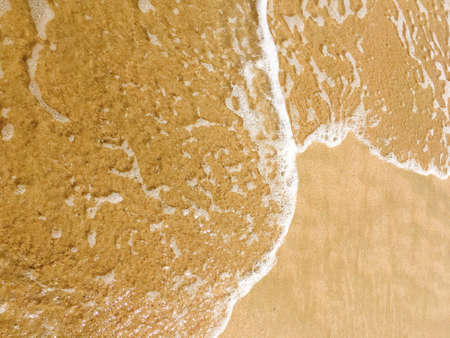 Sea waves reaching lapping to shore