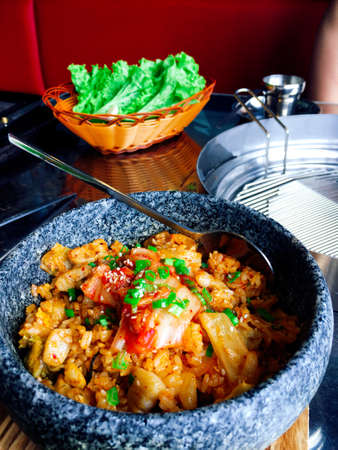 Hot bowl of Kimchi rice in Korean styleの写真素材