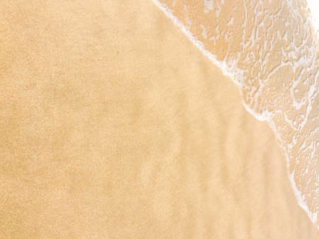 Sea waves reaching lapping to shoreの写真素材