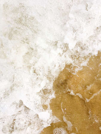 Sea waves reaching lapping to shoreの写真素材