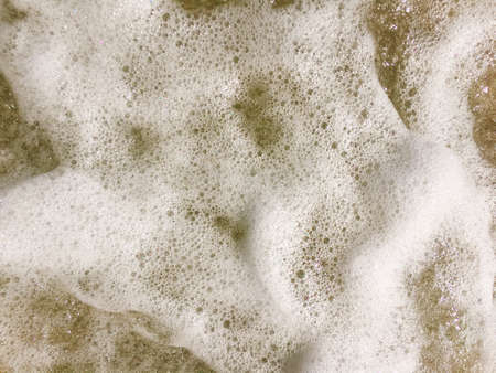Sea waves reaching lapping to shoreの写真素材