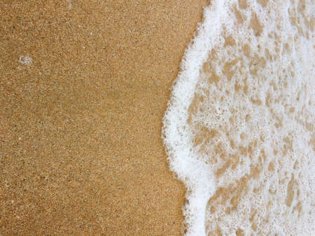Sea waves reaching lapping to shoreの写真素材