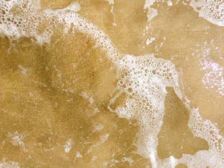 Sea waves reaching lapping to shoreの写真素材