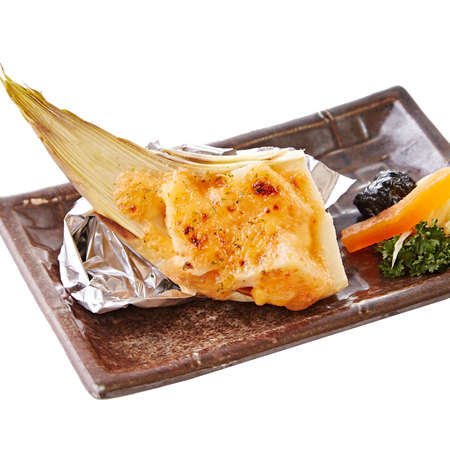 Fried salmon fin on black paltterの写真素材