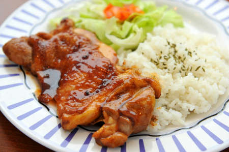 Platter of rice with grilled pork ribs  and lettuceの写真素材