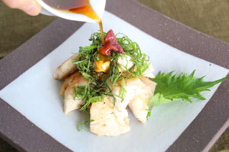 Chicken plum meat green fruit oil sprinkleの写真素材