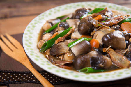 Sauteed mushroom with onion on the tableの写真素材