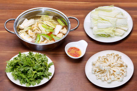 Prepared hot pot of seafood in Vietnamese style with mushroom, fish sauceの写真素材